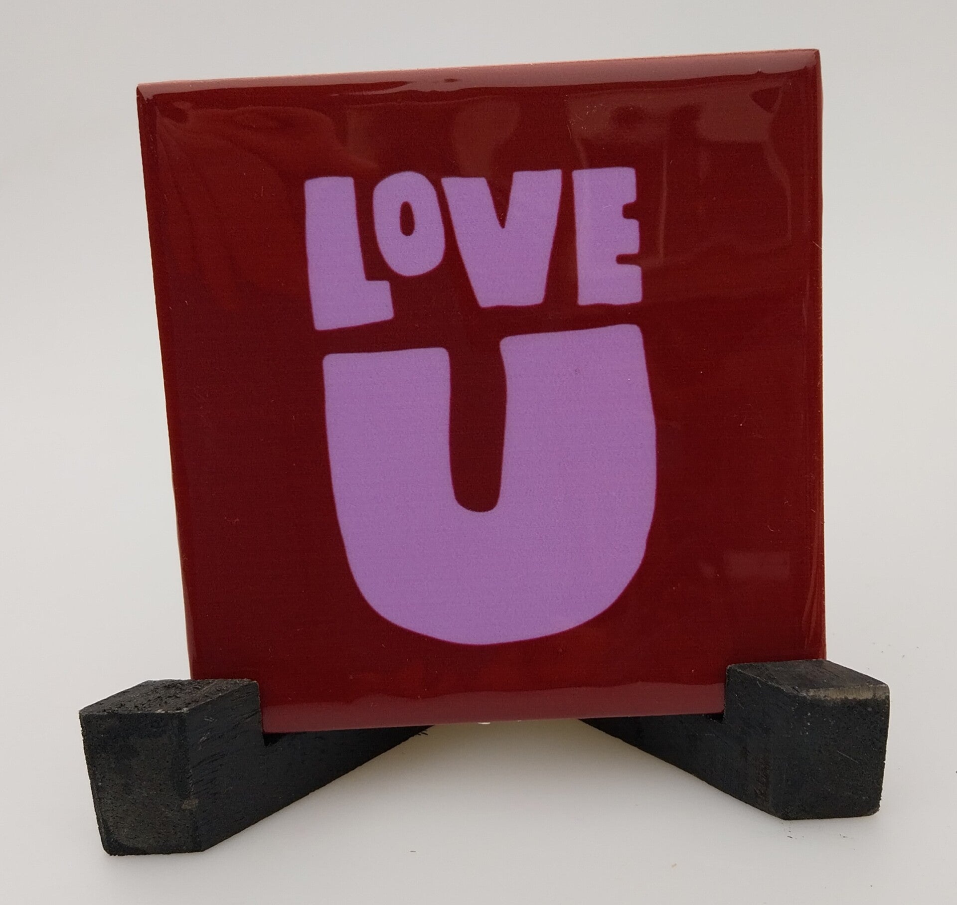 Tegeltje love u