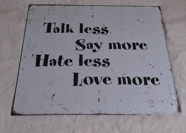 Metalen bord talk less love more