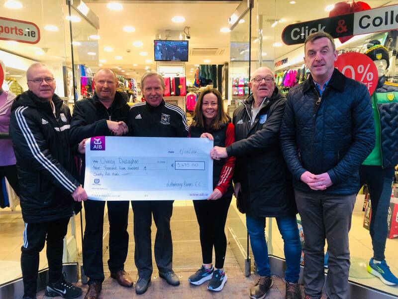 Patrick McGettigan winner of the Letterkenny Rovers FC Lotto Jackpot of 6000 euro receiving his prize money from the winning ticket seller Gerry Meehan