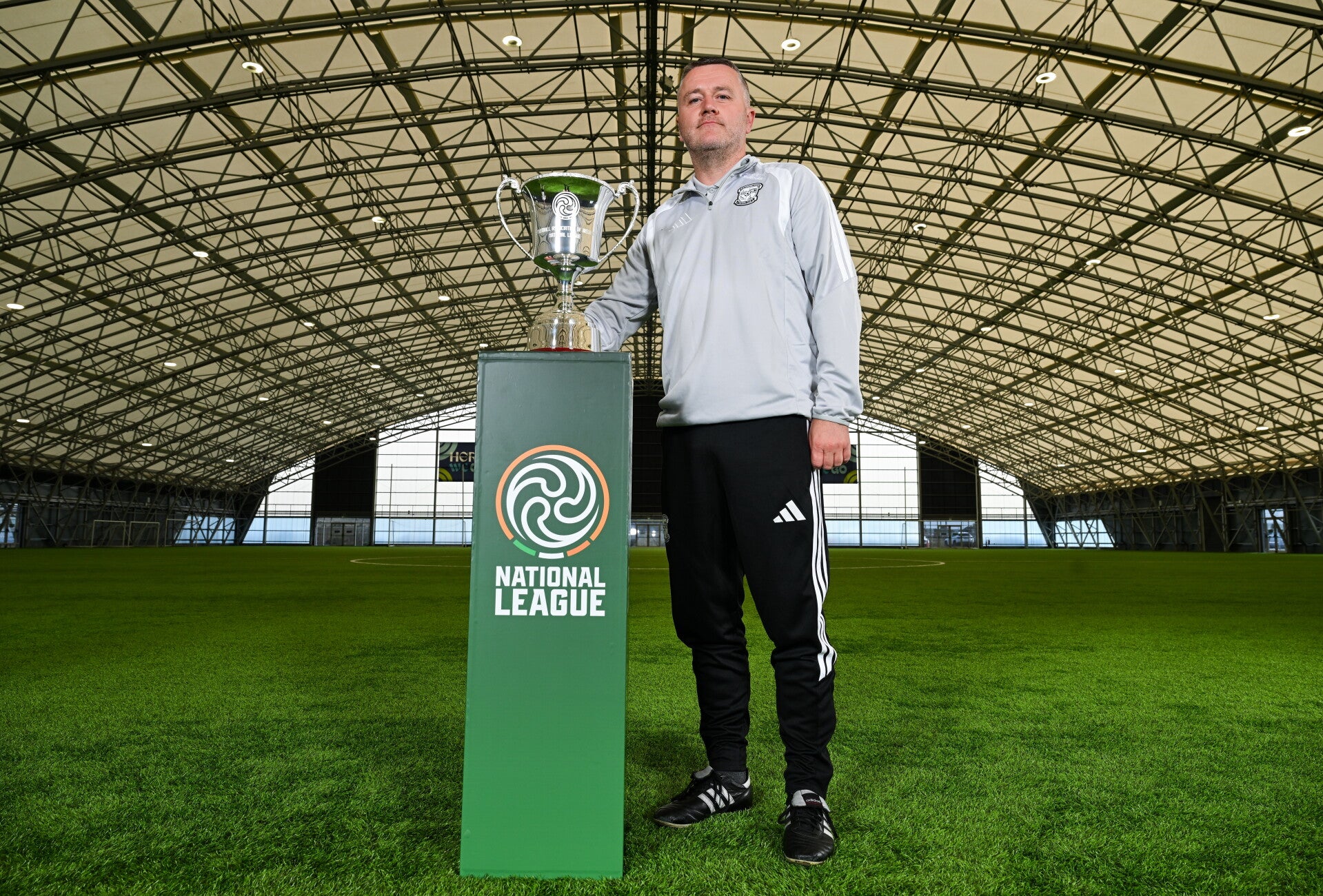 Letterkenny Rovers FAI National League team manager Stephen McConnell pictured beside the new trophy