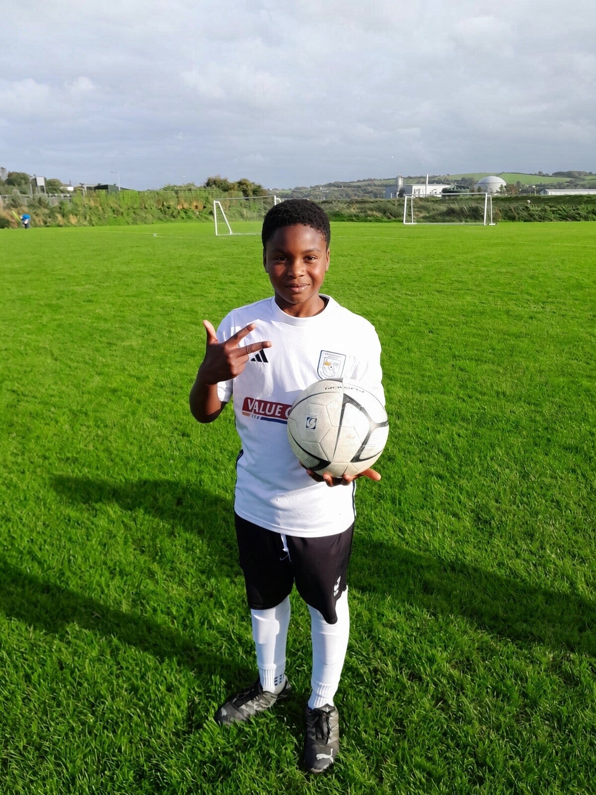 Player that scored a hat-trick, holding a ball