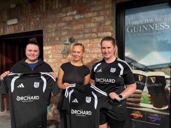 The Orchard Bar staff presenting new jerseys to our senior womens team for the season