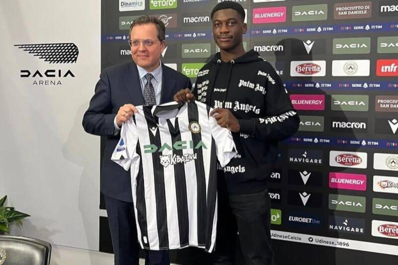 James Abankwah holding the jersey for Italian Serie A club Udinese who he recently signed for.