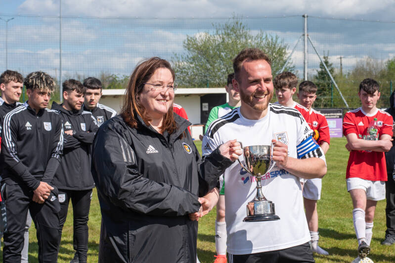 Ronan Curran Captain of the Rovers side being presented with the Cup for winning the league