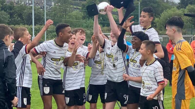 Evan Hickey lifts the cup in the U14 Premier Cup final was Letterkenny Rovers defeat Bonagee Utd 2-1 on the day