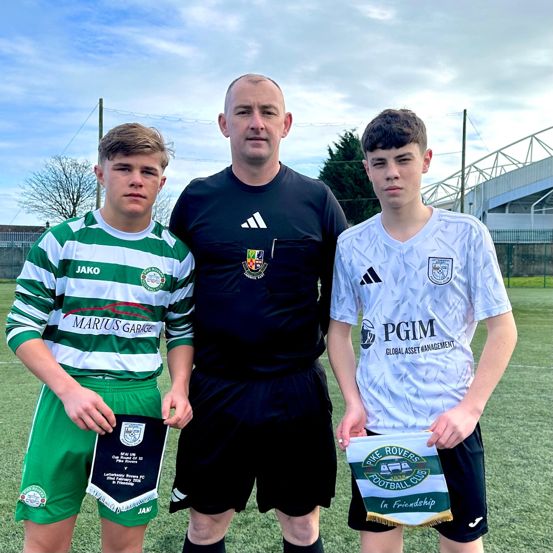 Pike Rovers Captain and Letterkenny Rovers Captain exchange pennants in advance of the game