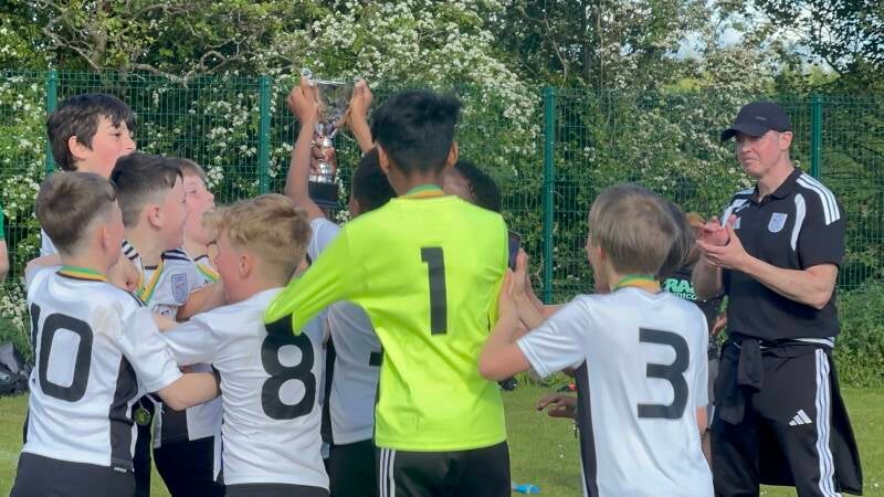 U12 Crusaders celebrate as they lift the trophy in the !st Division League Cup Final 24th May 2026