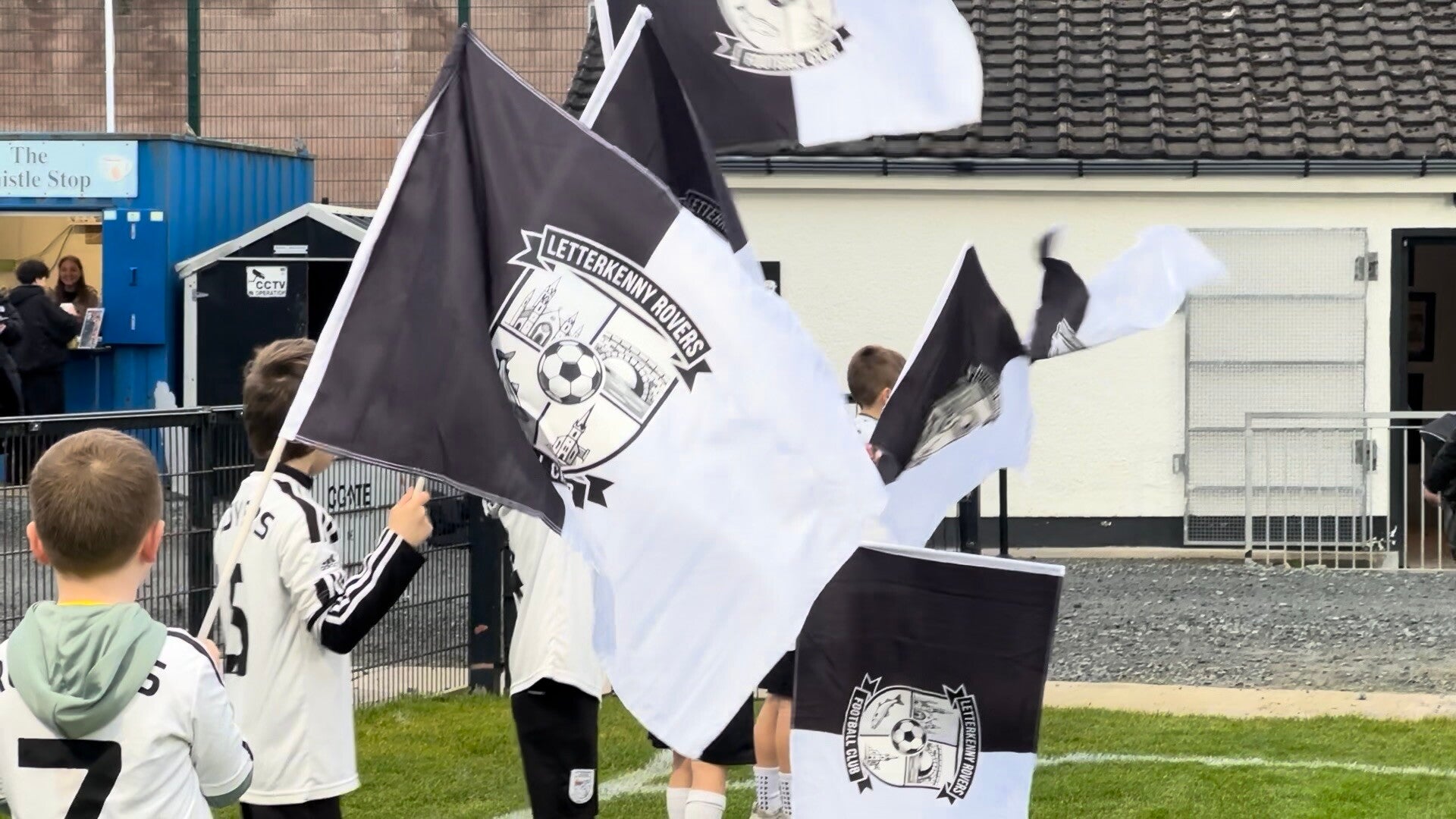 Flagbearers for Letterkenny Rovers line pitch in advance of kickoff