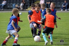 Children enjoting Junior Rovers at Leckview Park learning to play football