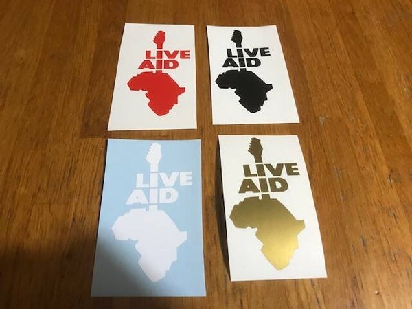 LIVE AID STICKER AUTOCOLLANT VINYLE- 4.5 CM PAR 10.5 CM