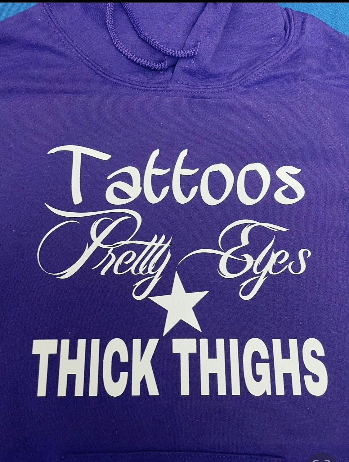 Tattoos, pretty eyes and thick thighs