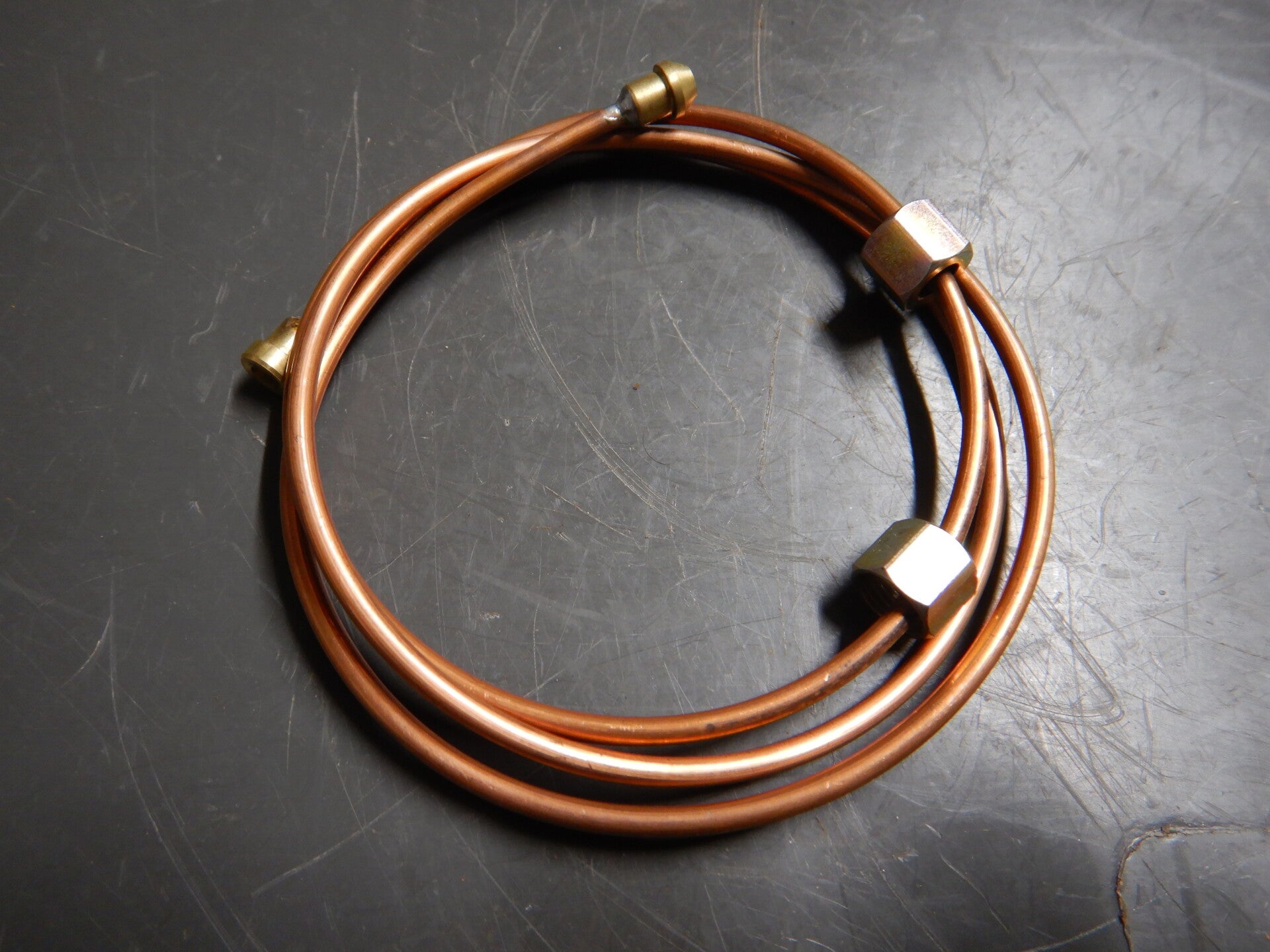 Pipe, oil gauge to flexible pipe   AHH6678