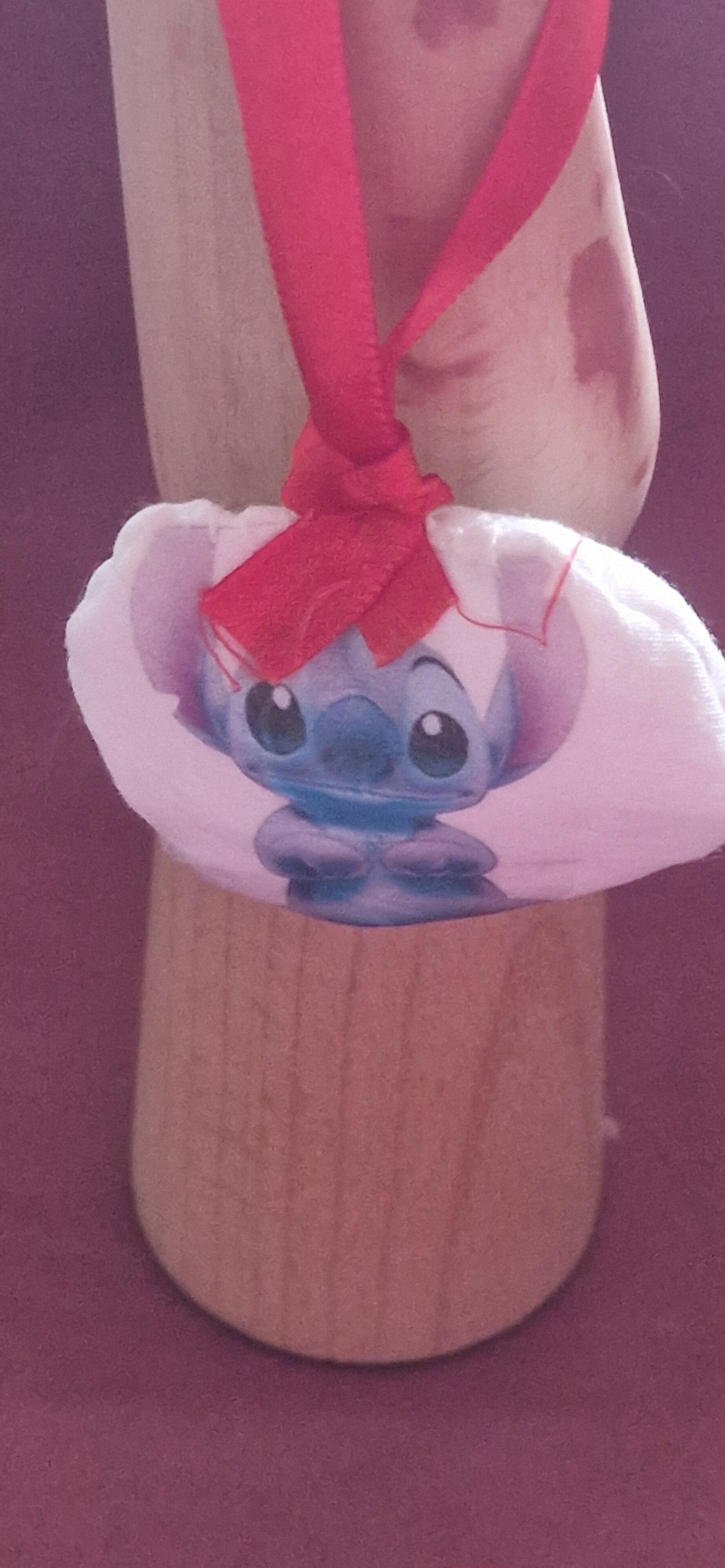 Boule de Noël en tissu motif stich bras croisés