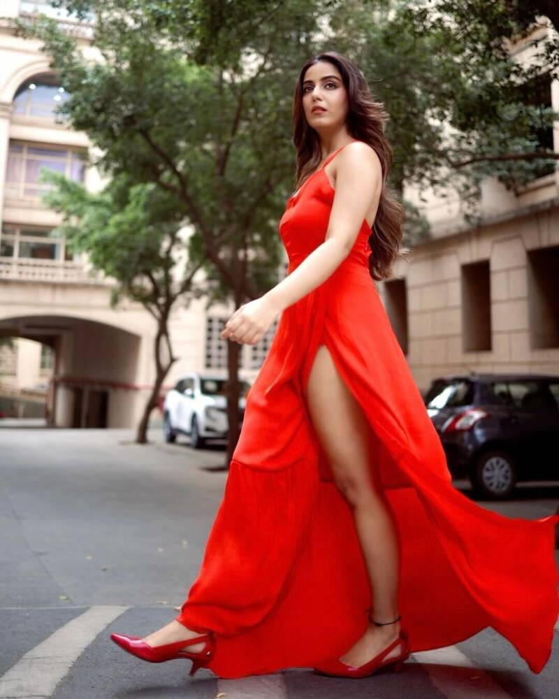 Srishty Rode in red slit dress on the street 