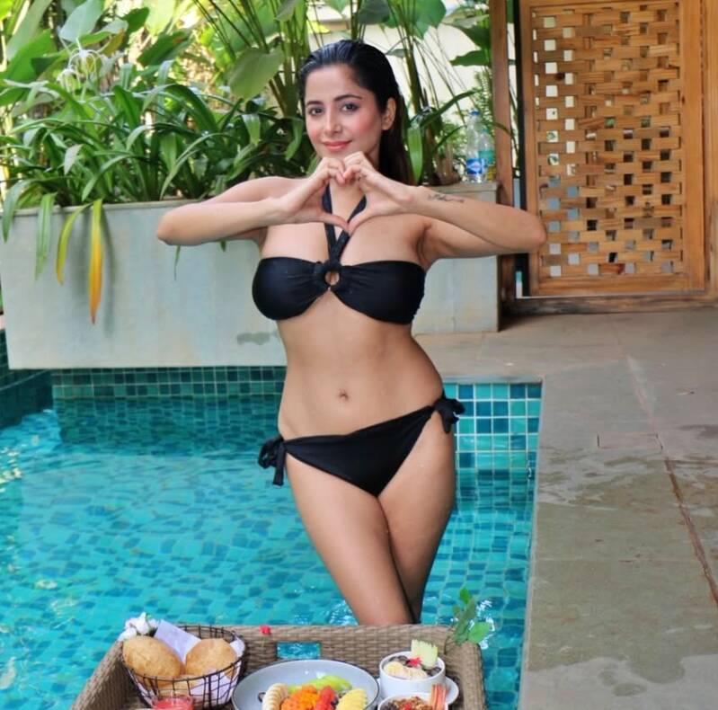 Kate Sharma in black bikini hotel swimming pool