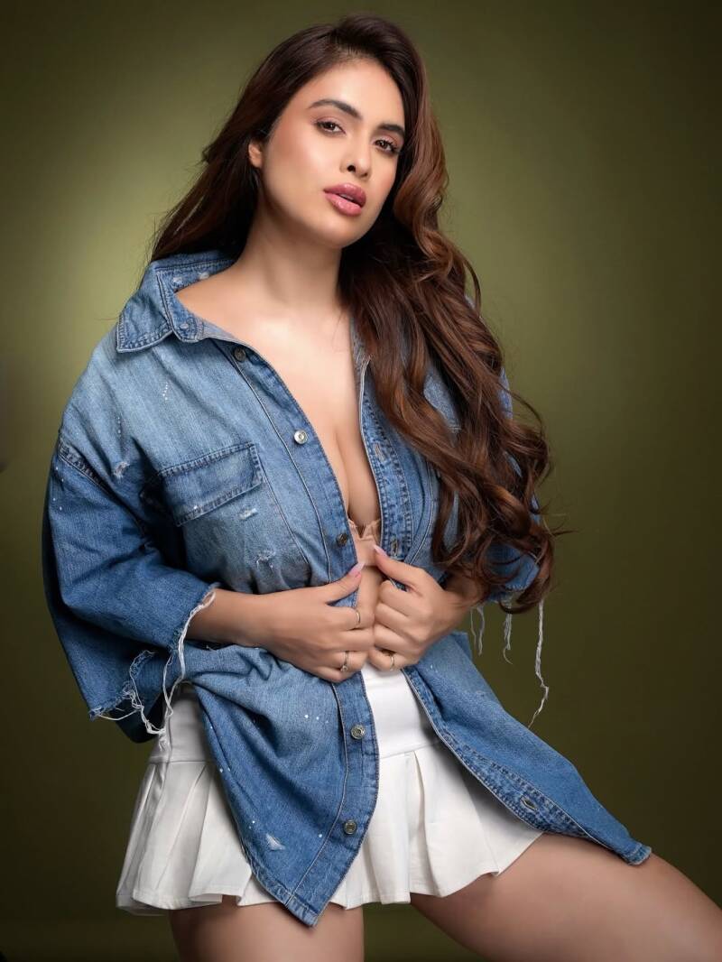 neha-malik-big-cleavage-in-jeans-shirt-and-white-skirt-photoshoot2-standard.jpg