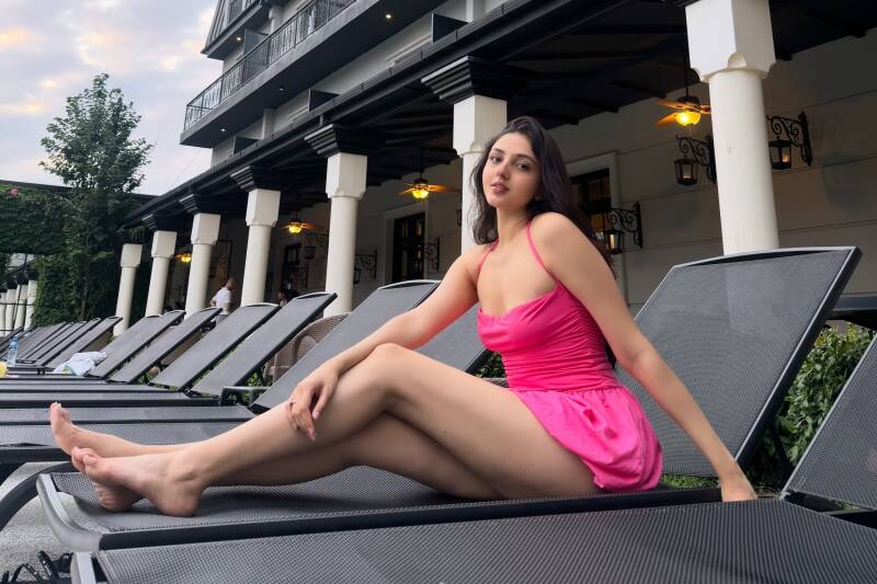 Purvaai Patel hot thigh show in pink frock in the hotel lawn chair 