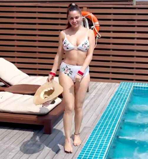 Shraddha Arya in white bikini in hotel swimming pool 
