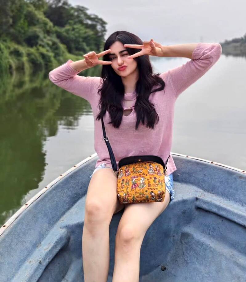 Adah Sharma enjoying a boat ride on a lake 5