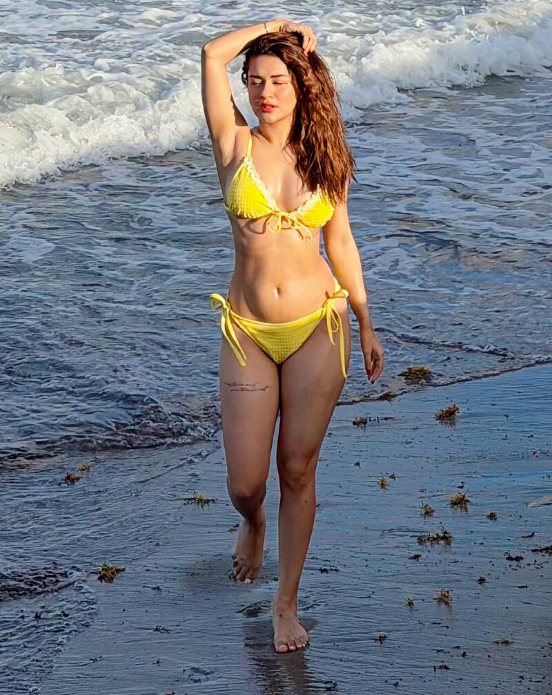 Avneet Kaur in yellow bikini lon the beach