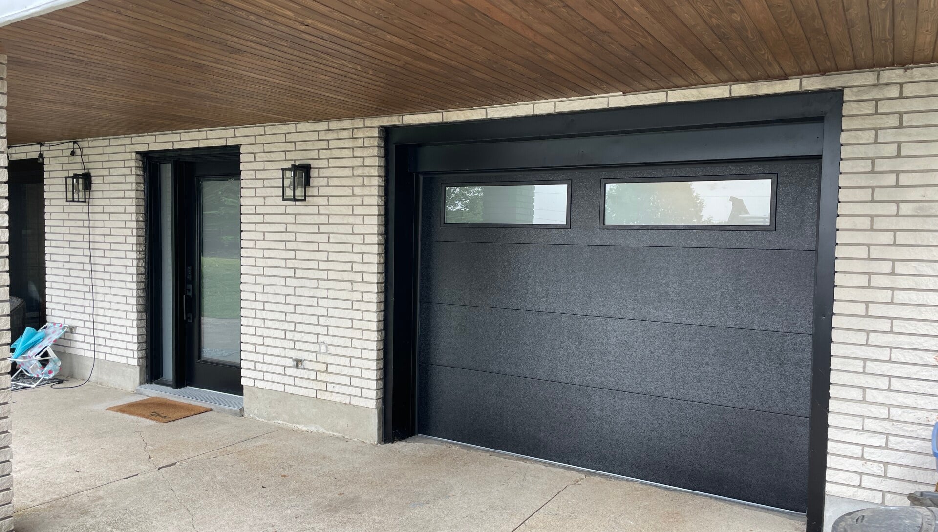 After modern black garage door