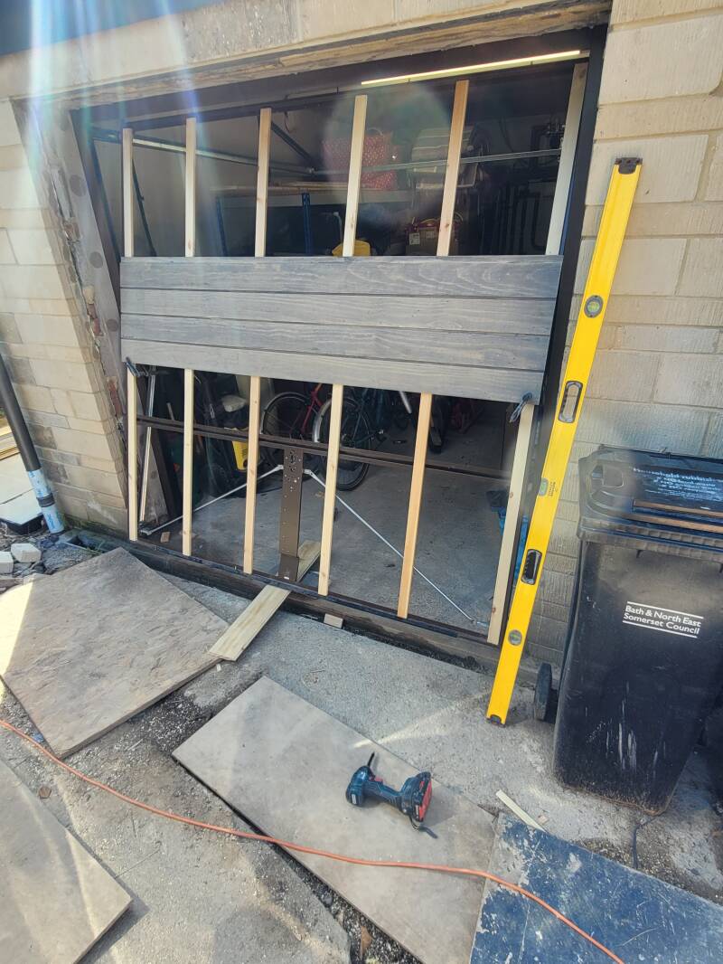 Garage door clad to match house