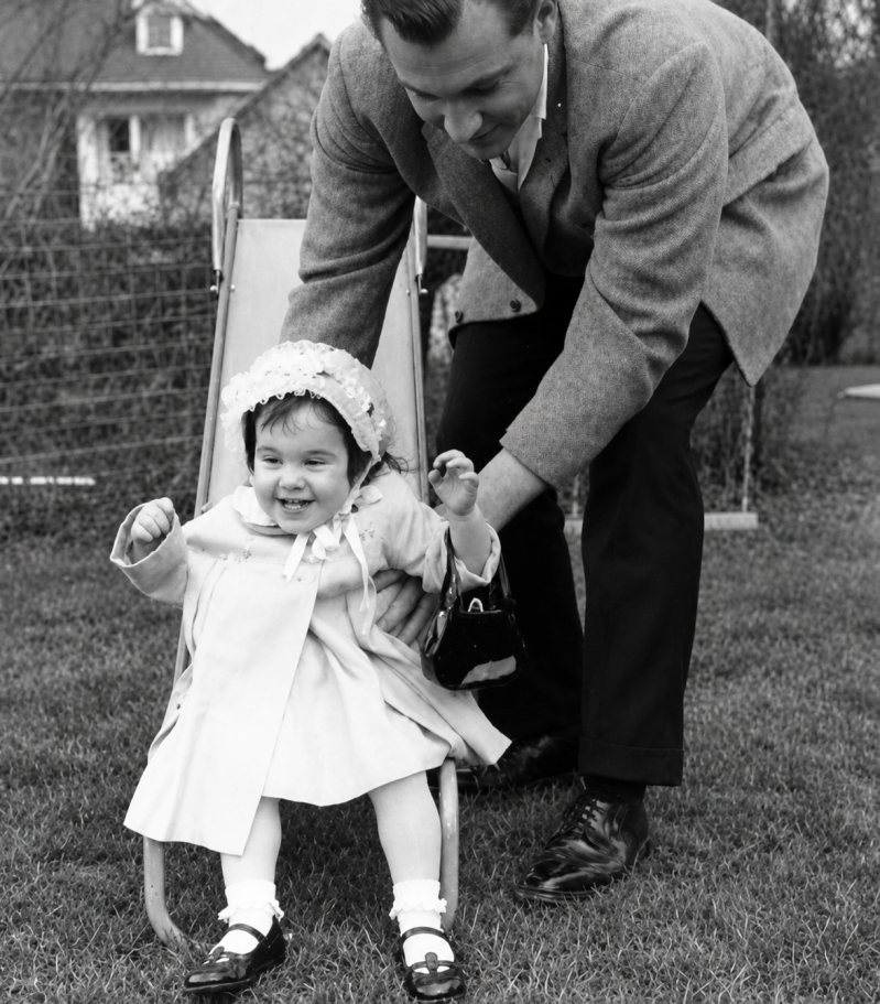 Dad with toddler playing 1963