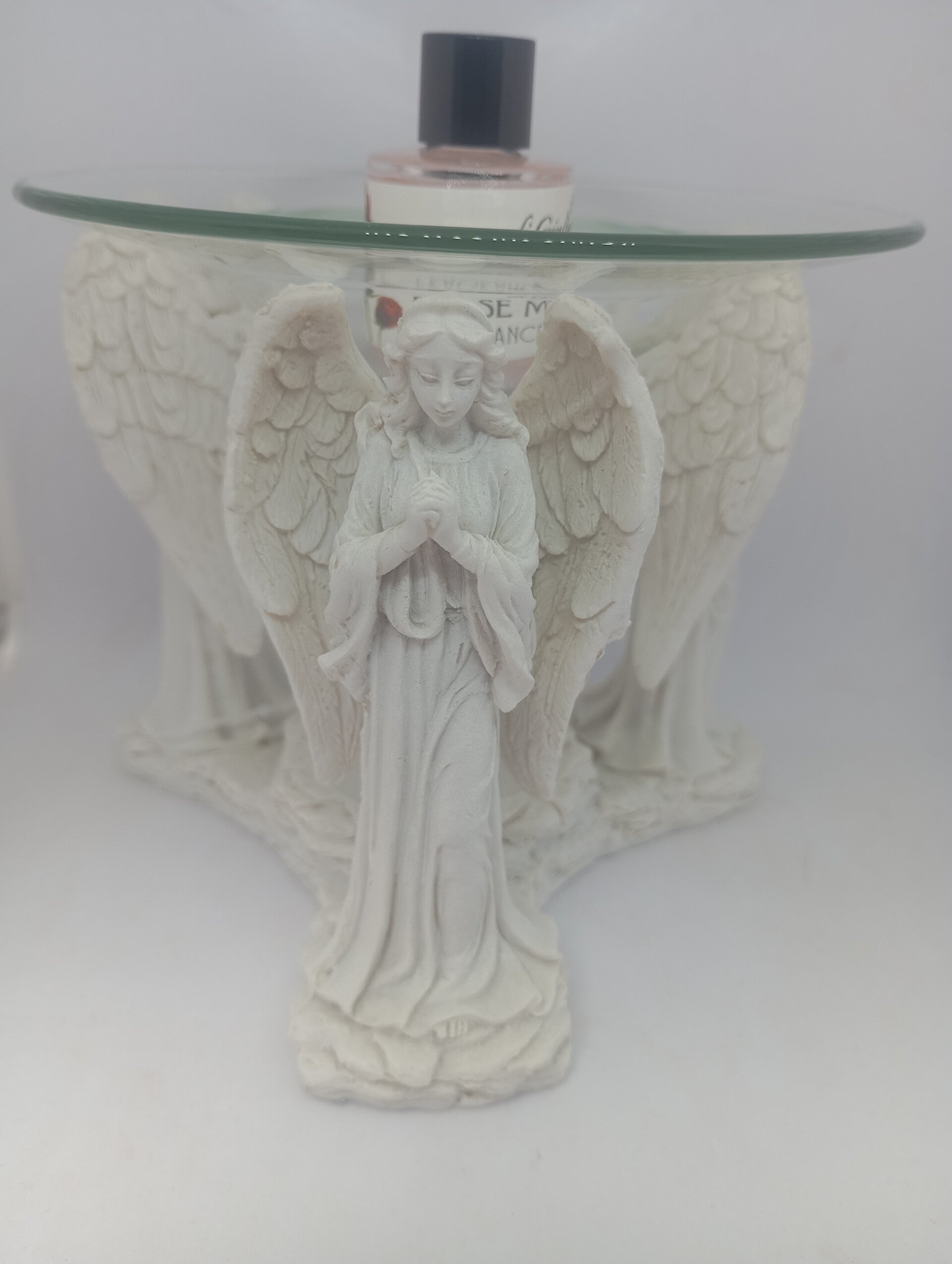 Angel oil burner with rose oil.