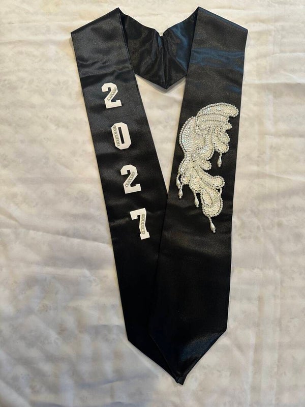 white lettered and winged black stole