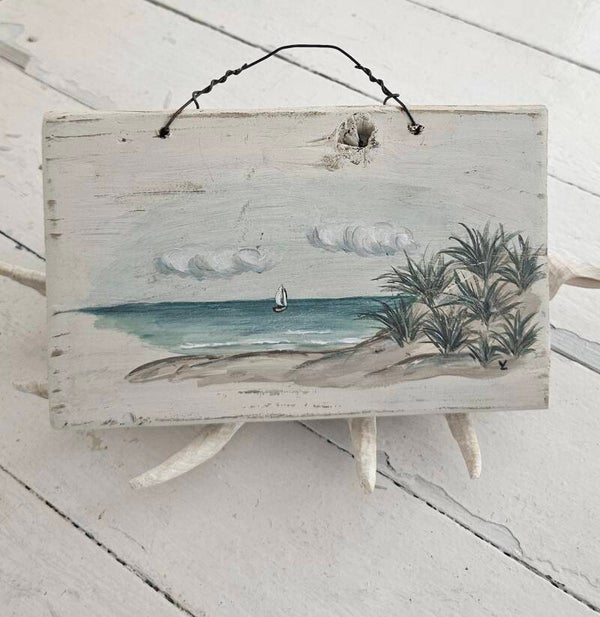 Strandtafereeltje met bootje