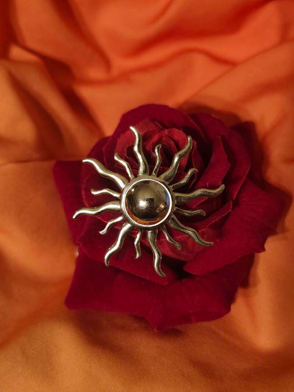 Broche soleil