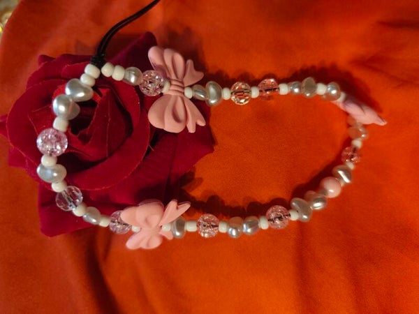 Charms téléphonne noeud rose