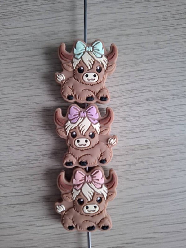 Schotse hooglanders met strik