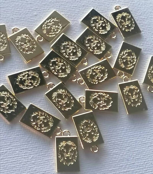 Gouden lion kop tags per 2 stuks RVS