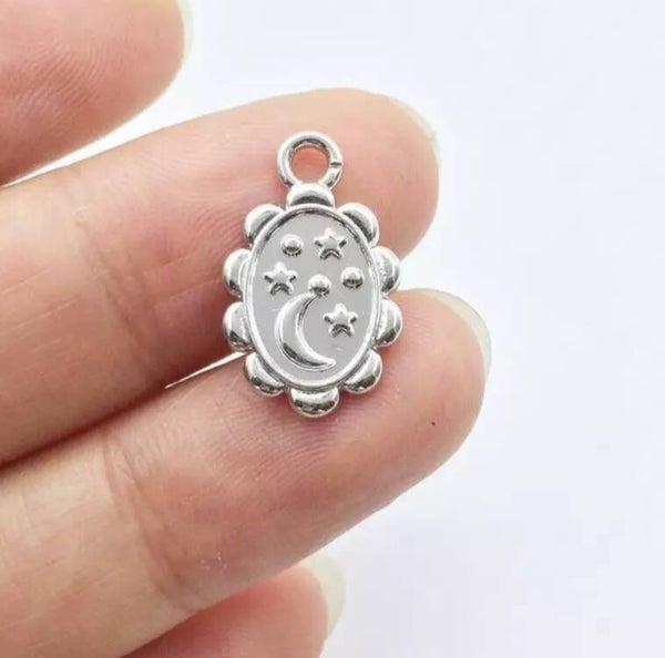 Zilveren star-moon tags per 2 stuks RVS