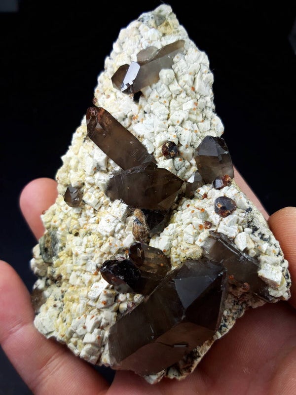 SPESSARTINE GARNETS ON MICROCLINE