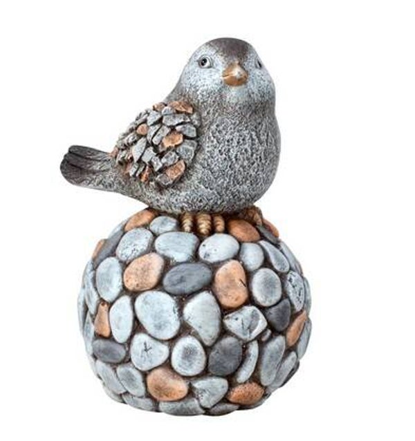 Oiseau sur boule de pierre