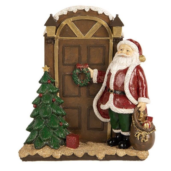 Père-Noël devant la porte