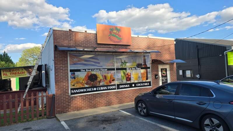 Restaurant storefront window graphics and exterior business signage.