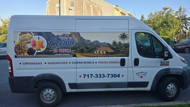 Partial wrap and commercial graphics on a Ram ProMaster food van.