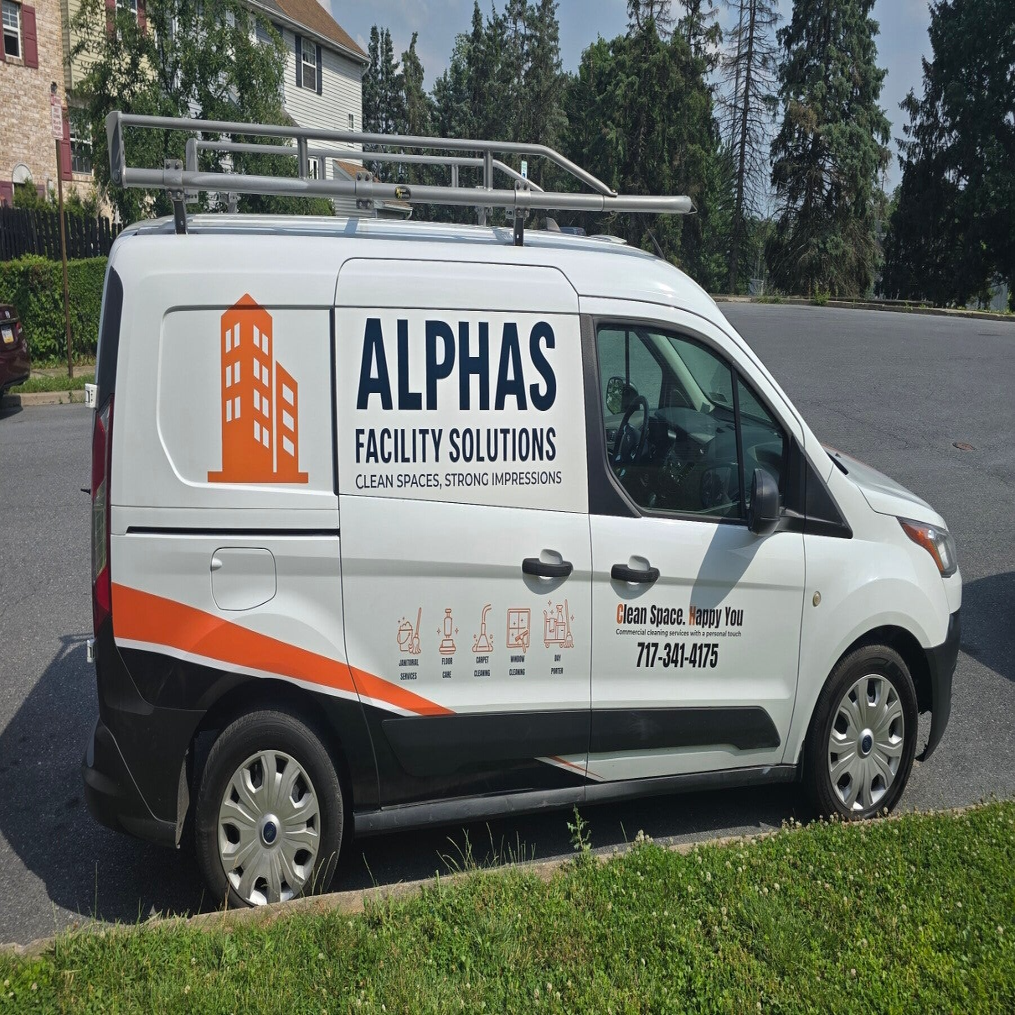 Commercial van with partial graphics and lettering for Alphas Facility Solutions, from ArtDesignStudio's portfolio