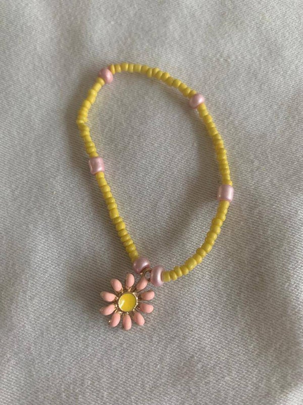 Armband geel met roze met bloem Ibiza style