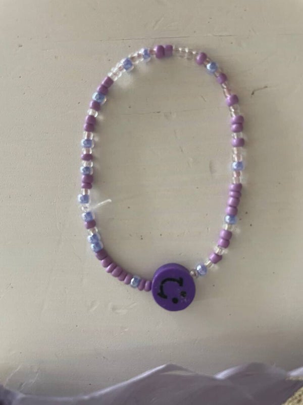 Armband paar, blauw en zilver met paarse smiley