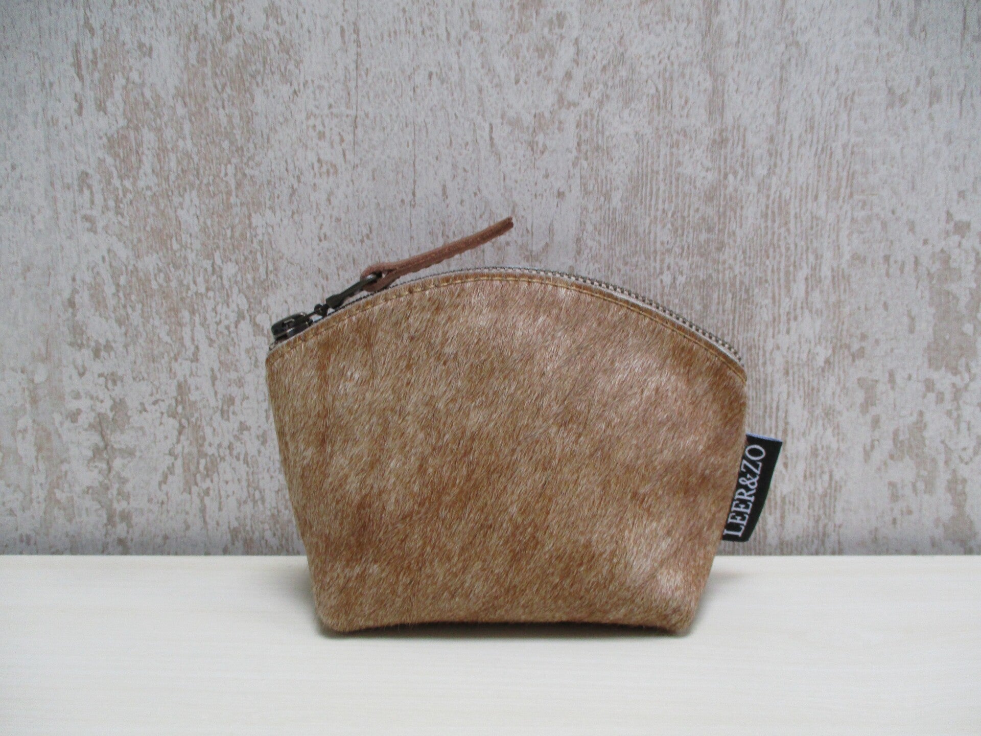 Koeienhuid make-up tasje cognac