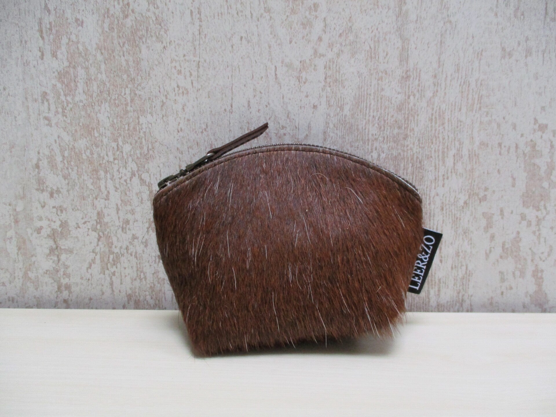 Koeienhuid make-up tasje donkerbruin