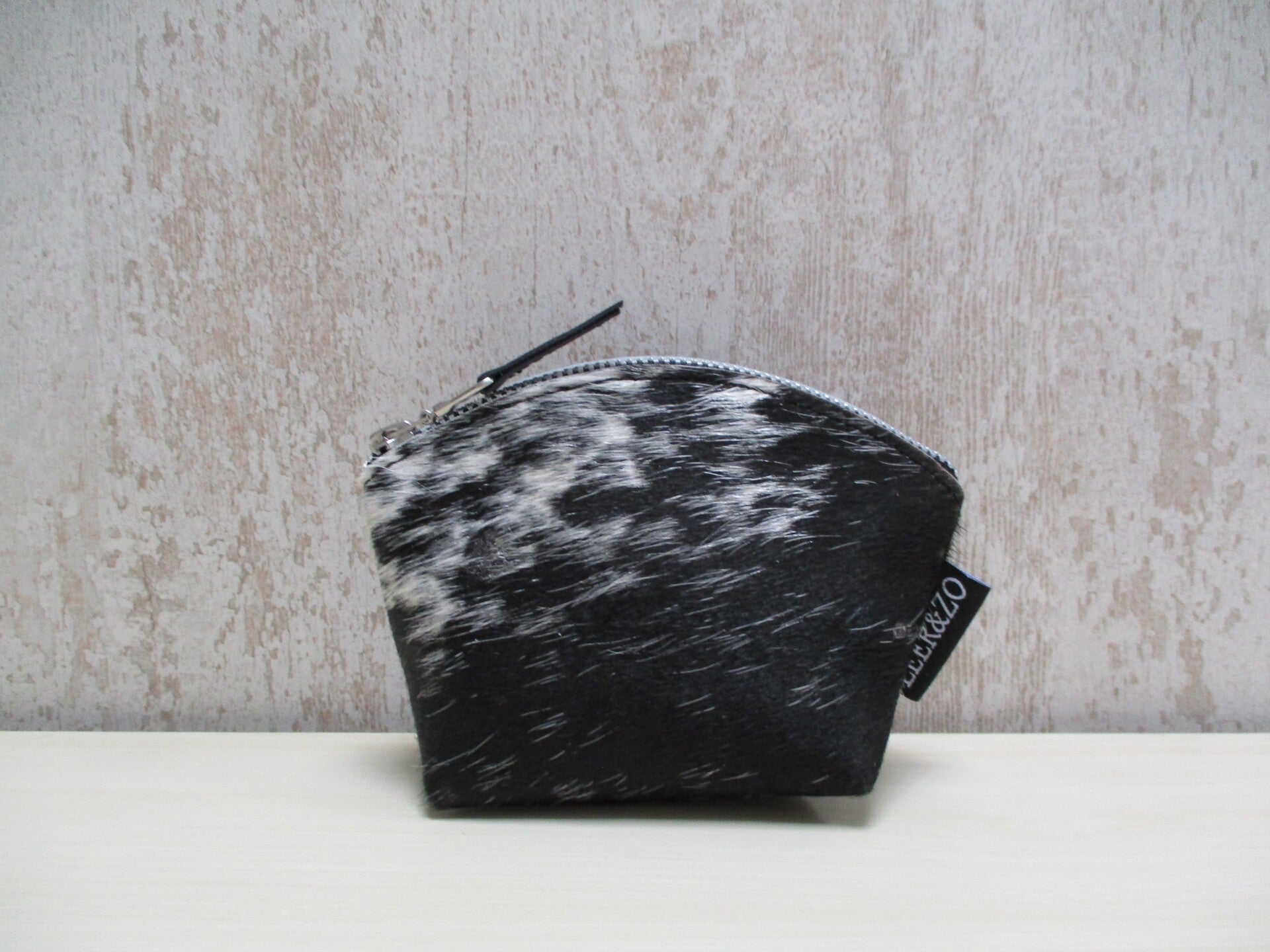 Koeienhuid make-up tasje zwart/wit
