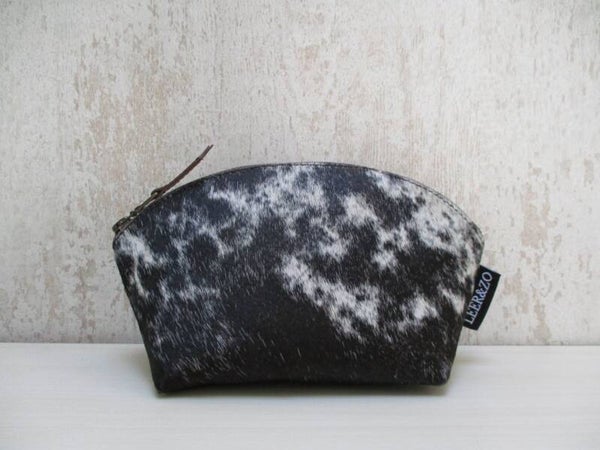 Koeienhuid make-up tas zwart/wit gevlekt