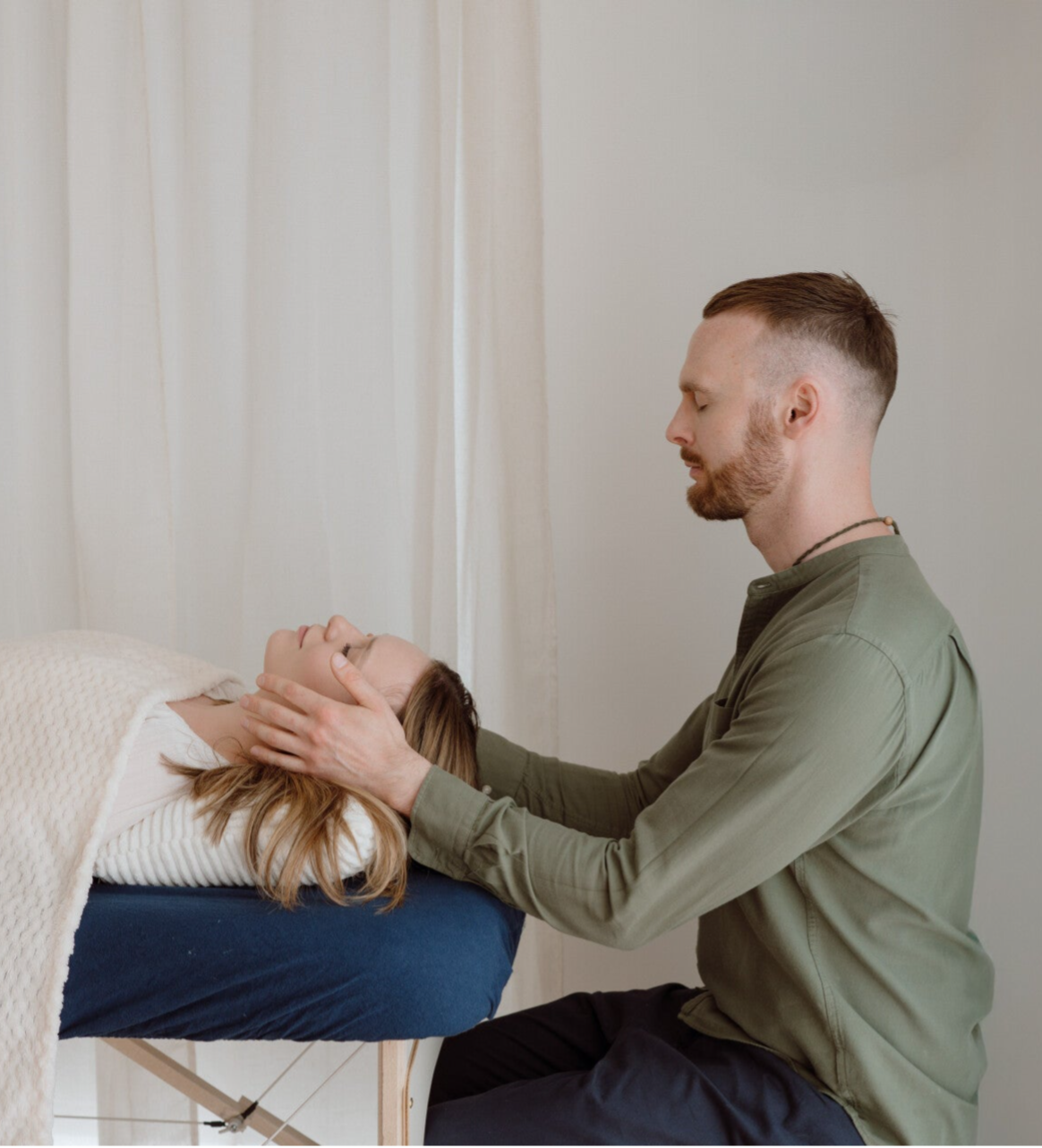 Reiki and Seichem energy healing treatment with practitioner and client