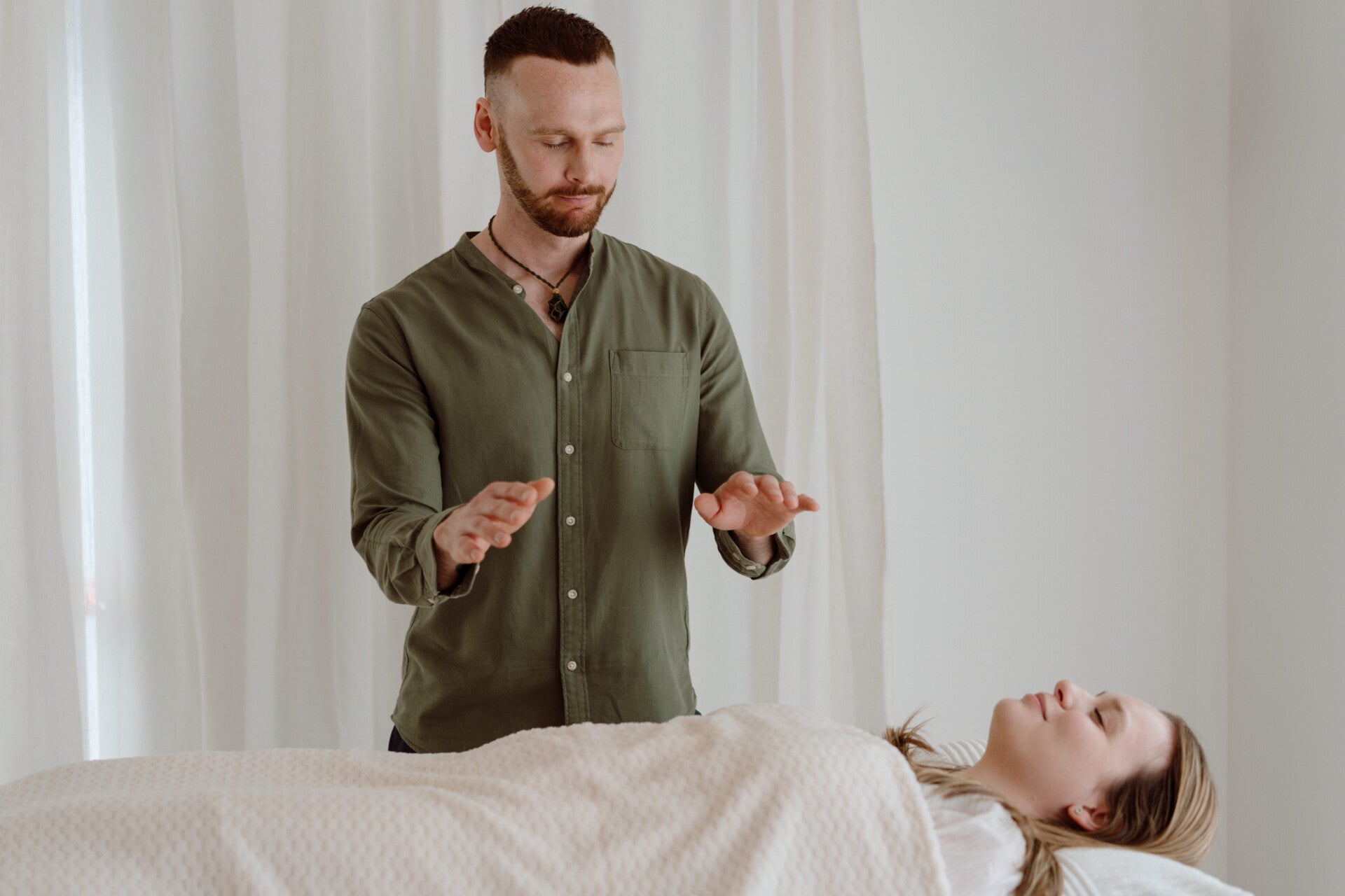 Client receiving Reiki and Seichem energy healing during an in-person session