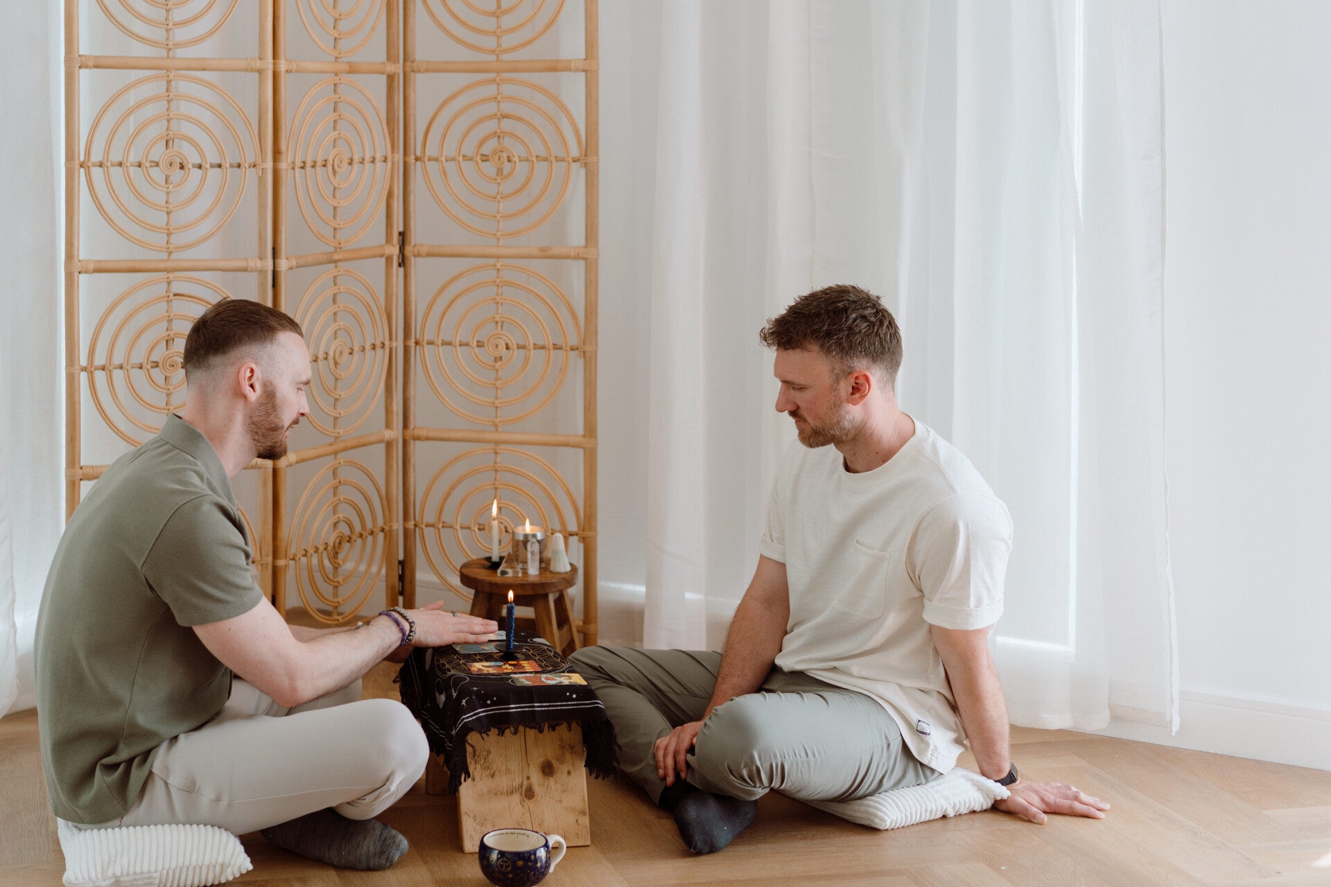 Tarot reading session with client and reader exploring the cards together